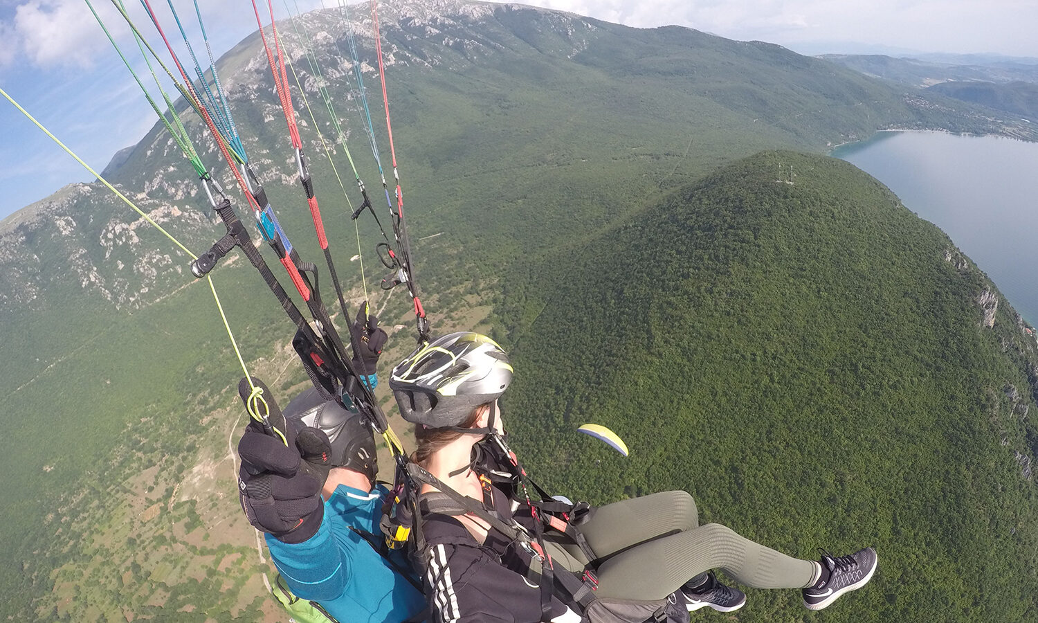 Paragliding high with a friend above Galicica Ohrid